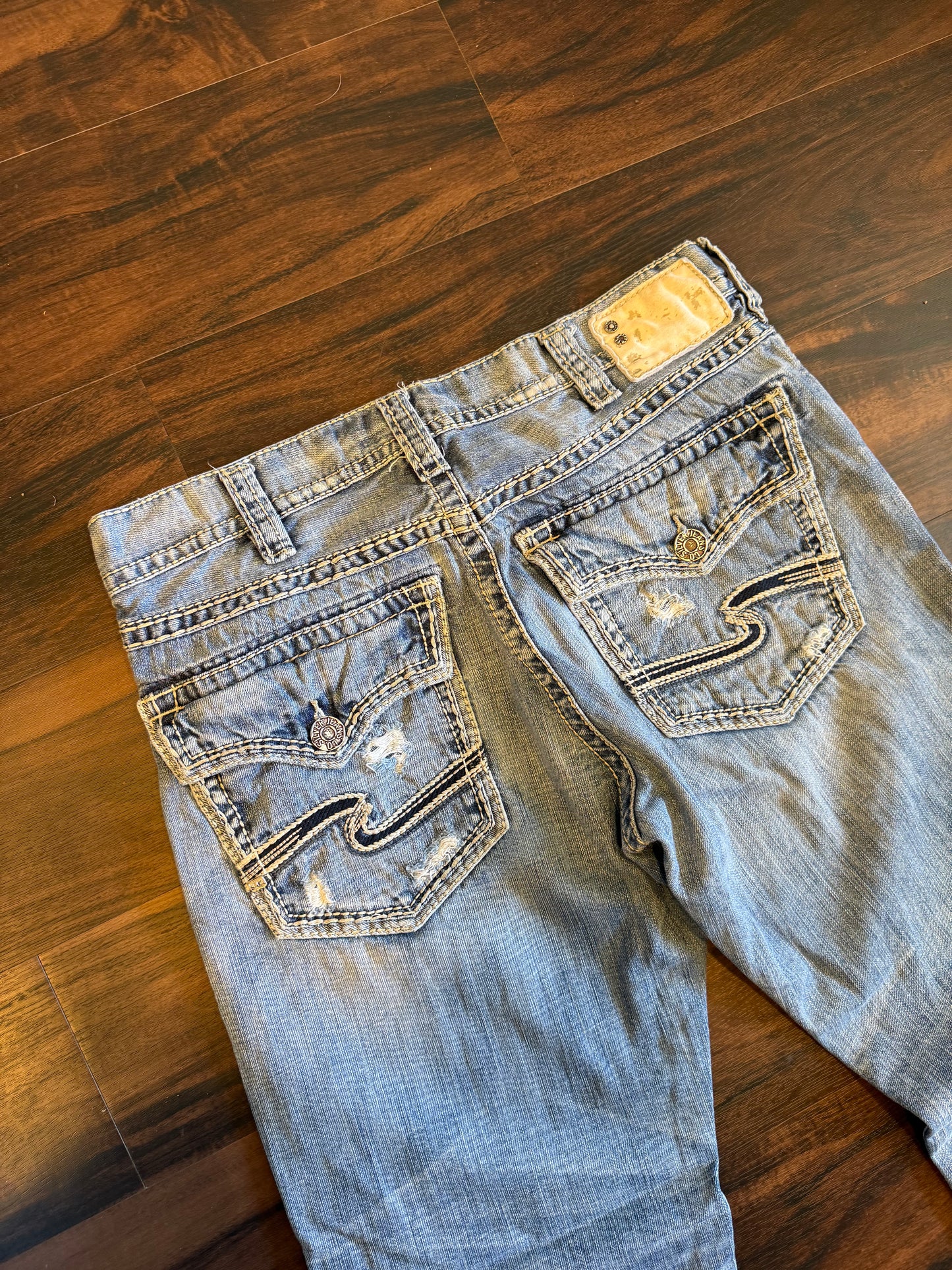 Vintage Silver Light Wash Distressed Boot Cut Jeans- 36x32