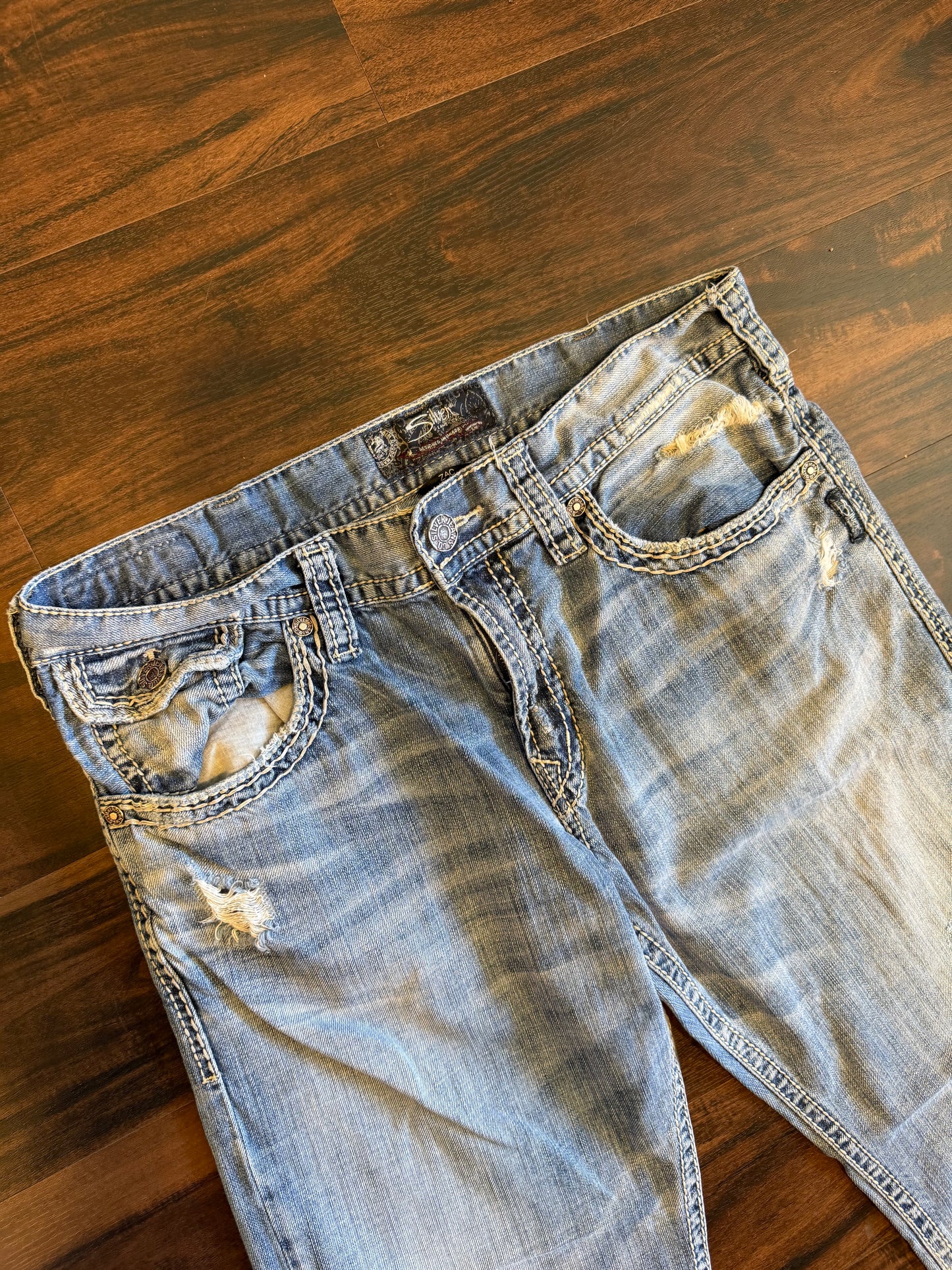 Vintage Silver Light Wash Distressed Boot Cut Jeans- 36x32